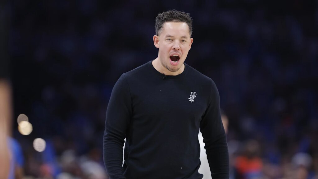 Dec 25, 2025; Oklahoma City, Oklahoma, USA; San Antonio Spurs head coach Mitch Johnson screams during a time out against the Oklahoma City Thunder during the second half at Paycom Center. Mandatory Credit: Alonzo Adams-Imagn Images