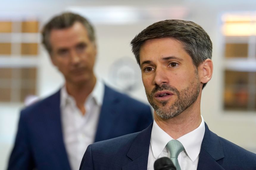 San Jose Mayor Matt Mahan, right, discusses a proposal from California Gov. Gavin Newsom, left,  in Sacramento on March 16, 2023.
