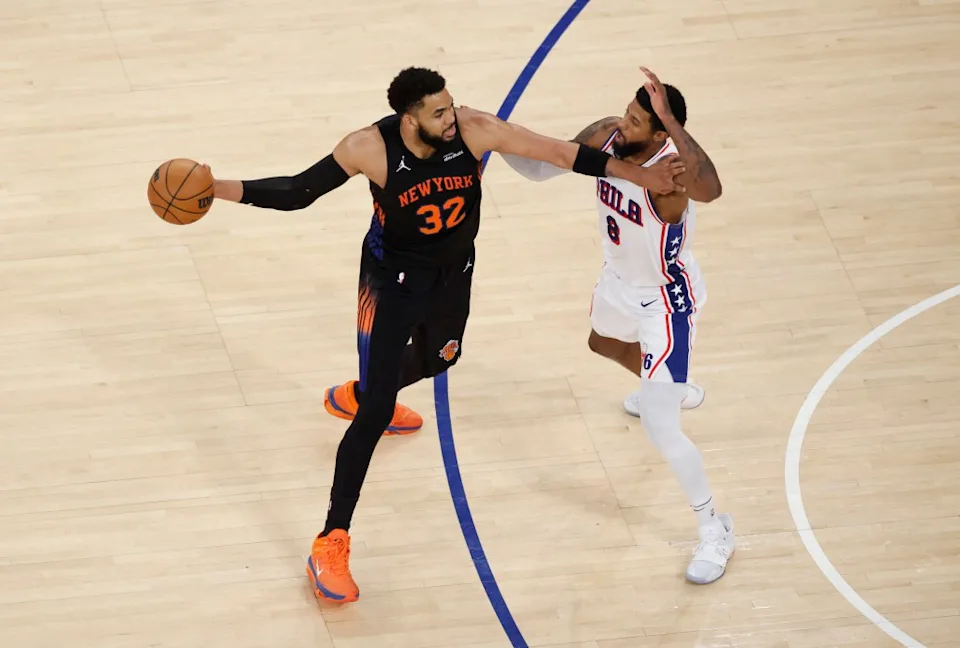 76ers forward Paul George (8) defends against New York Knicks center Karl-Anthony Towns (32) during the fourth quarter. Jason Szenes for the New York Post