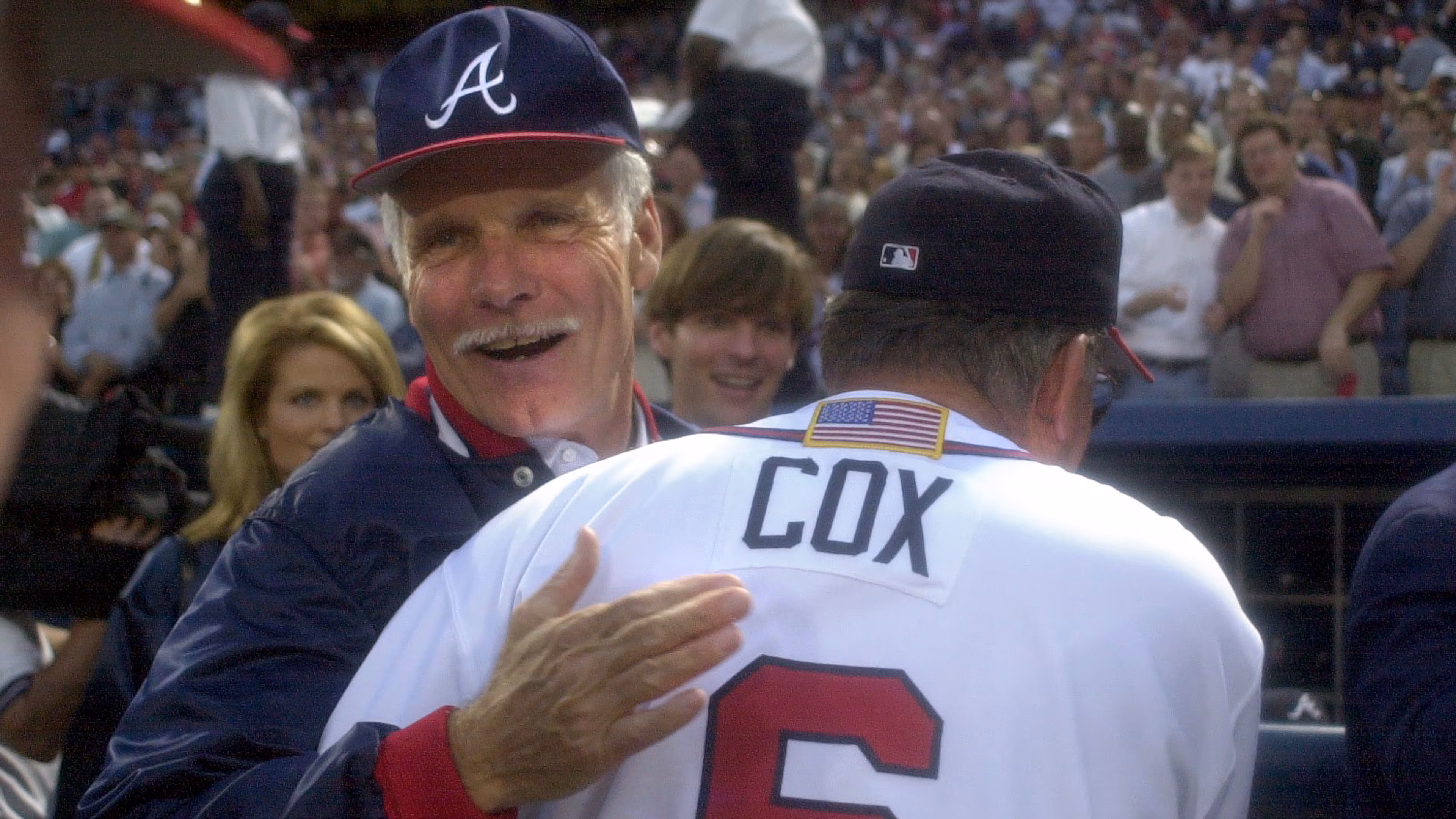 Longtime Atlanta Braves owner Ted Turner congratulates manager Bobby Cox following their 6-2 win over the Houston Astros in Game 3 of the National League Division Series on Friday, Oct. 12, 2001. The two franchise icons died last week. (Marlene Karas/AJC 2001)