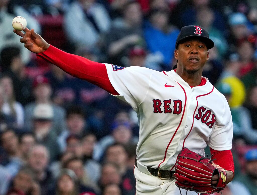 Red Sox pitcher Brayan Bello fires to first base for the out after fielding a grounder in the second inning.