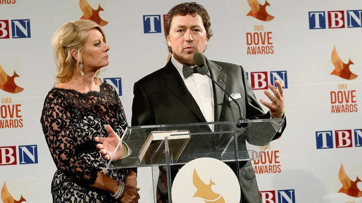 Lisa Robertson and Al Robertson standing backstage at the 45th Annual GMA Dove Awards
