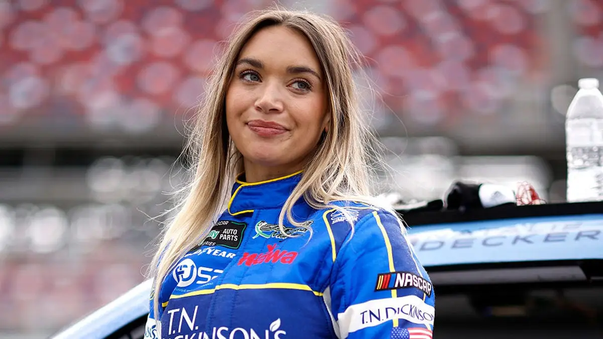 Natalie Decker standing on the grid at Talladega Superspeedway during qualifying