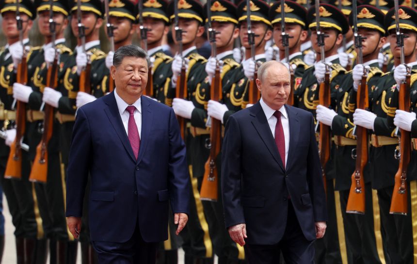 Russian President Vladimir Putin and Chinese leader Xi Jinping inspect an honor guard during a welcoming ceremony at the Great Hall of the People in Beijing on May 20.