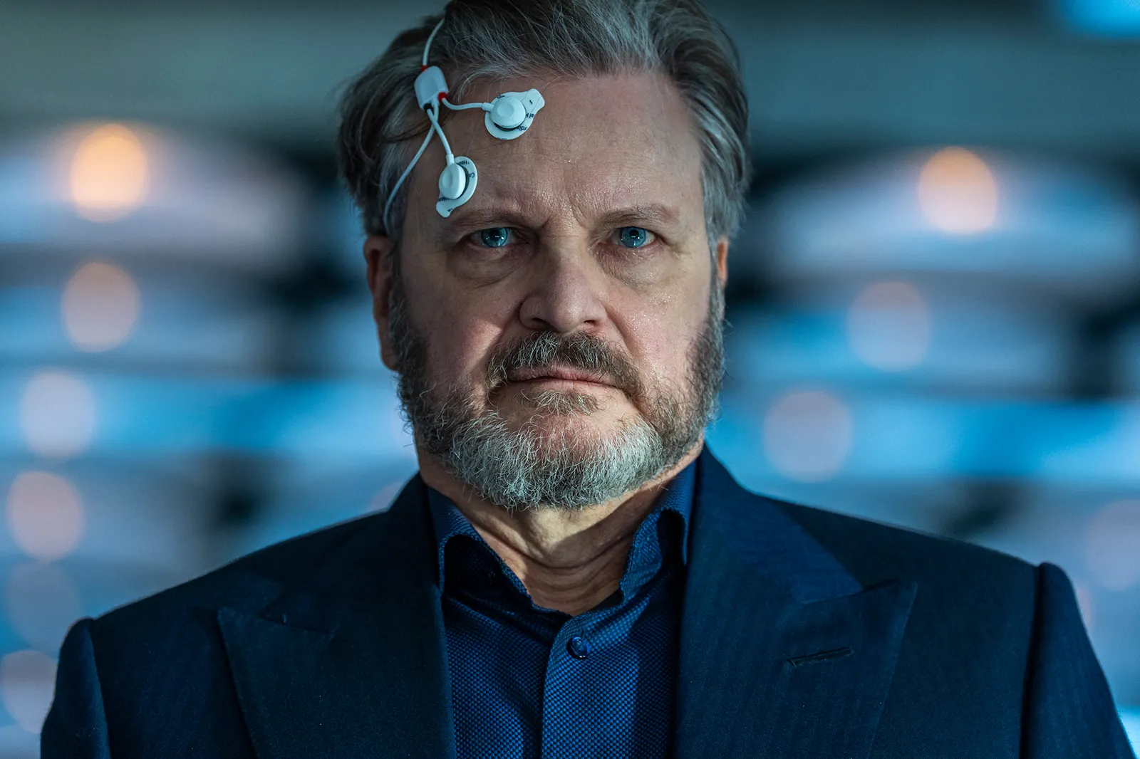 Image may contain Colin Firth Face Head Person Photography Portrait Beard Adult Clothing and Coat