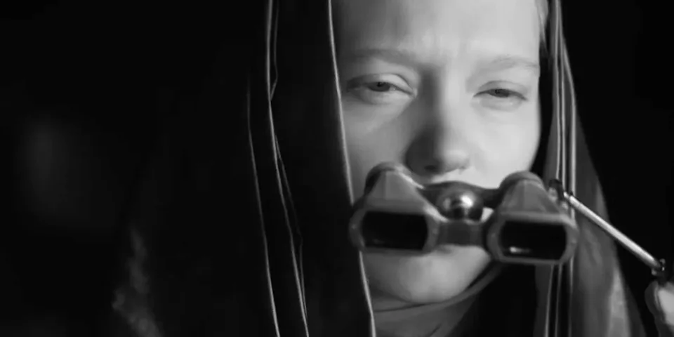 Léa Seydoux as Lady Margot Fenring looking through binoculars in Dune Part Two