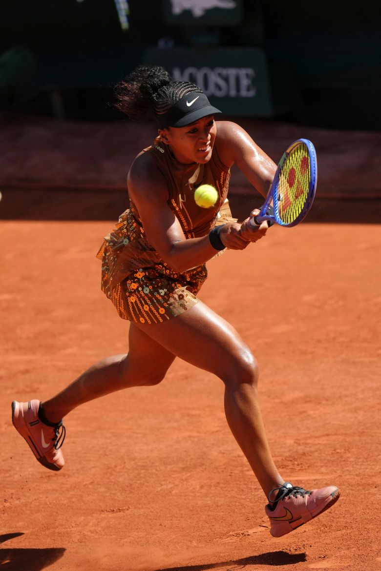 Osaka returning a shot during her first-round match.