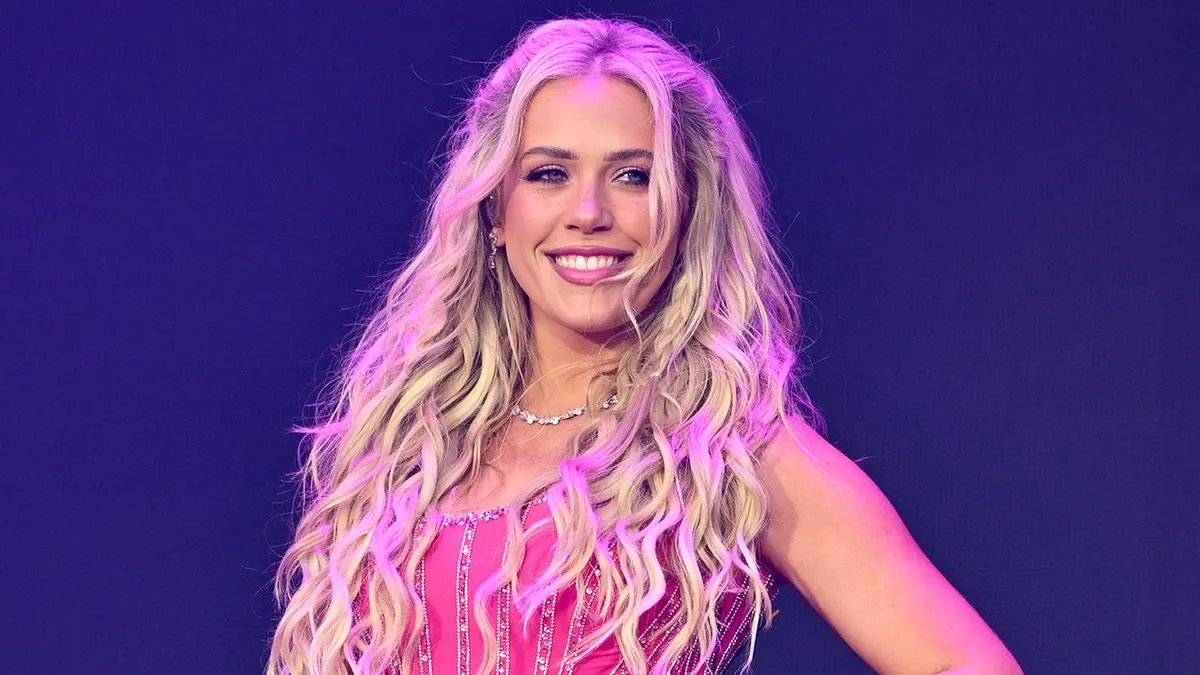 Megan Moroney in a pink dress while performing at March Madness in Indianapolis, Indiana in April 2026.