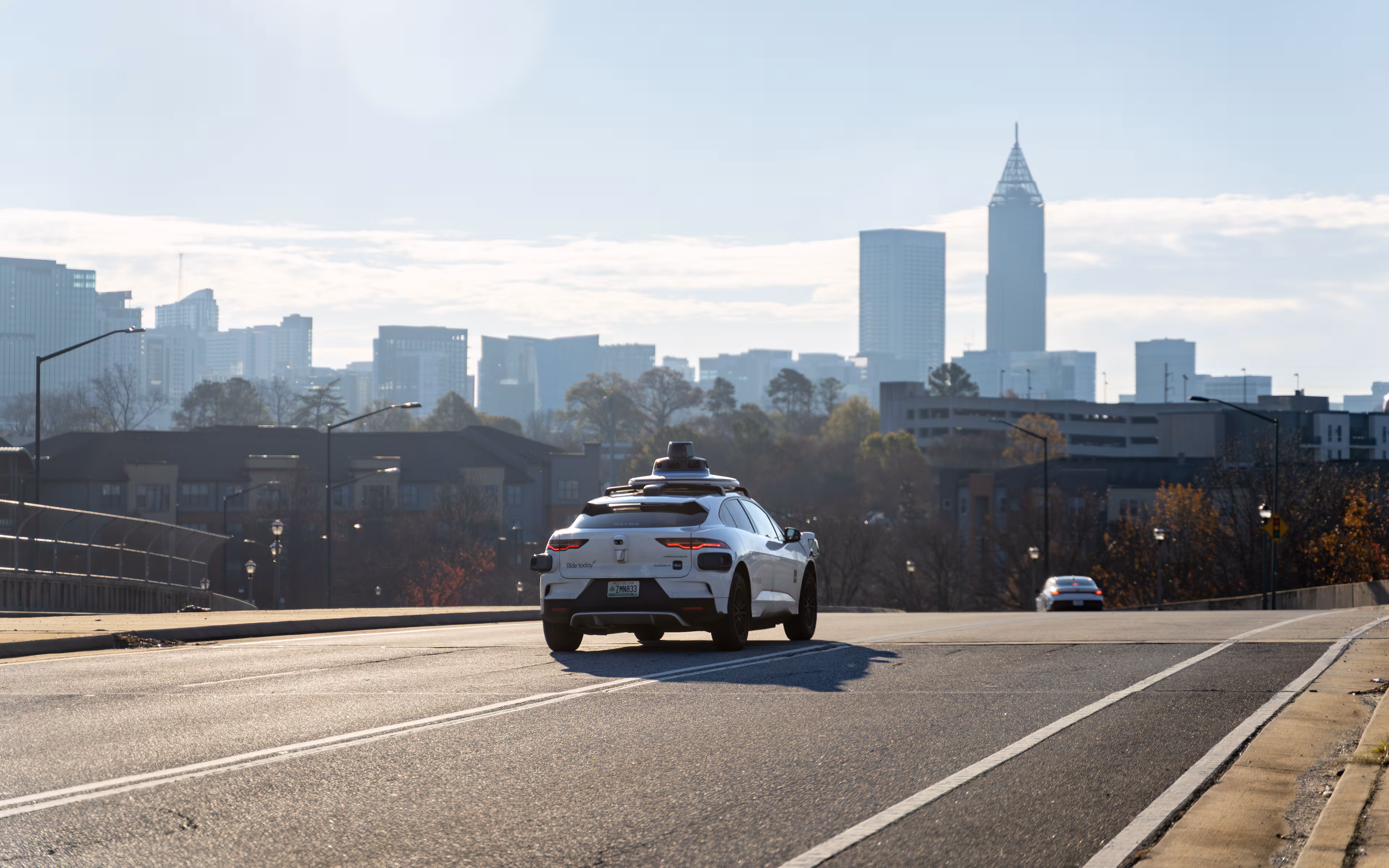 A Waymo self-driving taxi travels down 17th Street in Atlanta, Georgia, Thursday, Dec. 11, 2025. (Ben Hendren for the AJC)