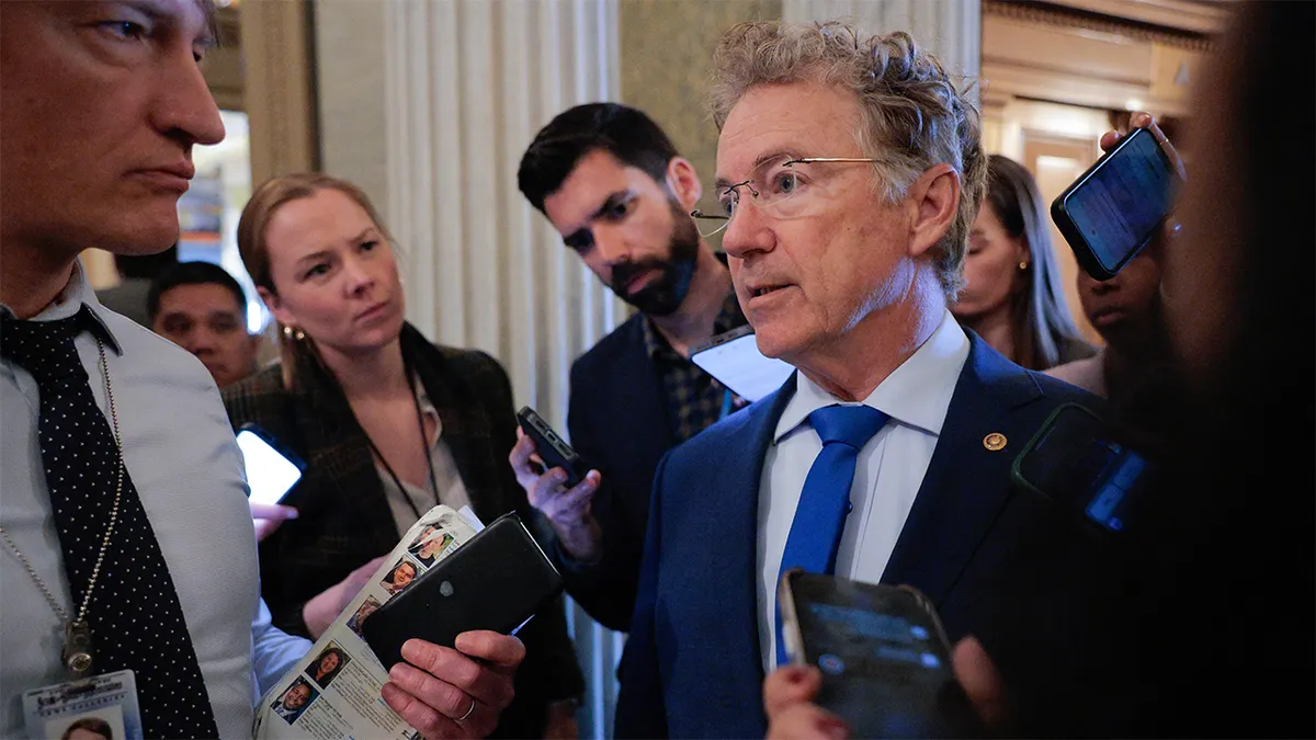 Sen. Rand Paul talking to reporters outside the Senate Chamber at the U.S. Capitol.