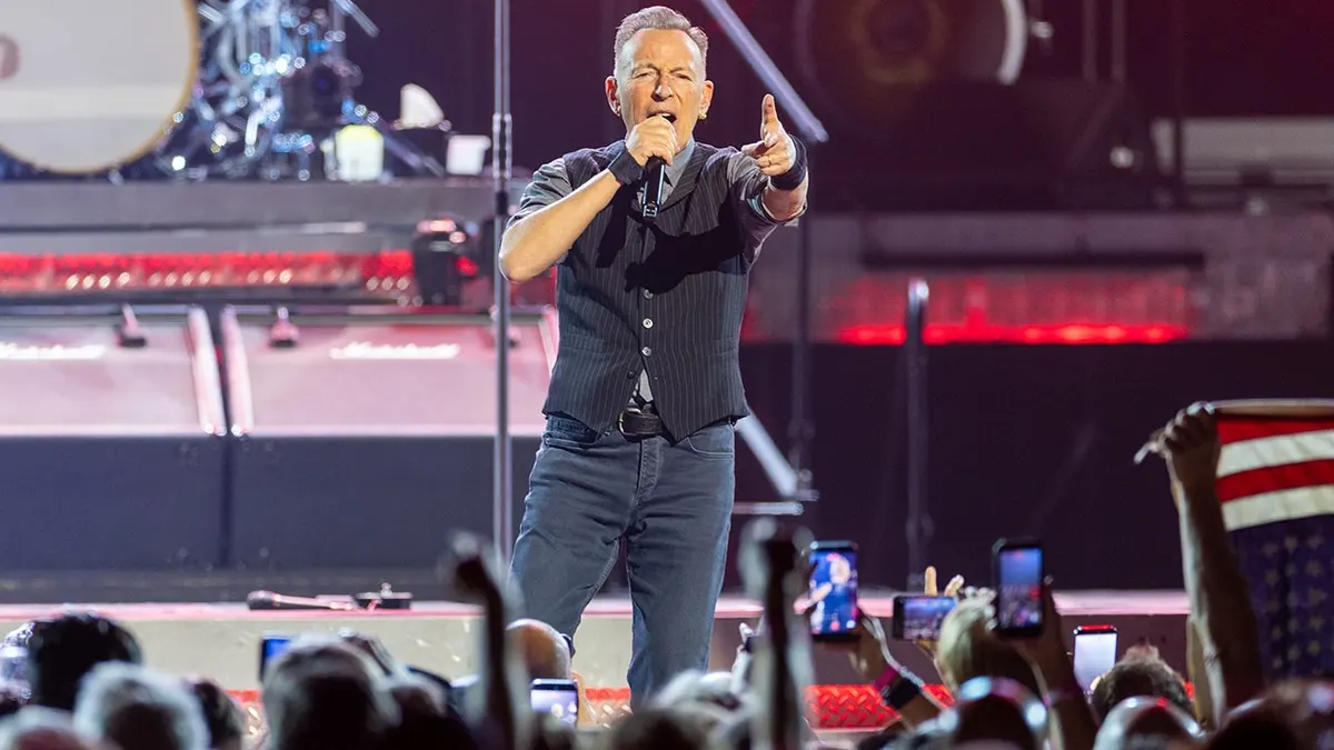 Bruce Springsteen and the E Street Band performing on stage at the Kia Forum in Inglewood