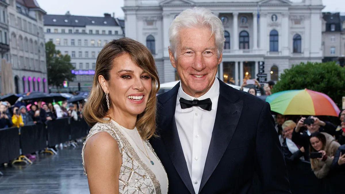 Alejandra Gere and Richard Gere posing together on green carpet at Zurich Film Festival