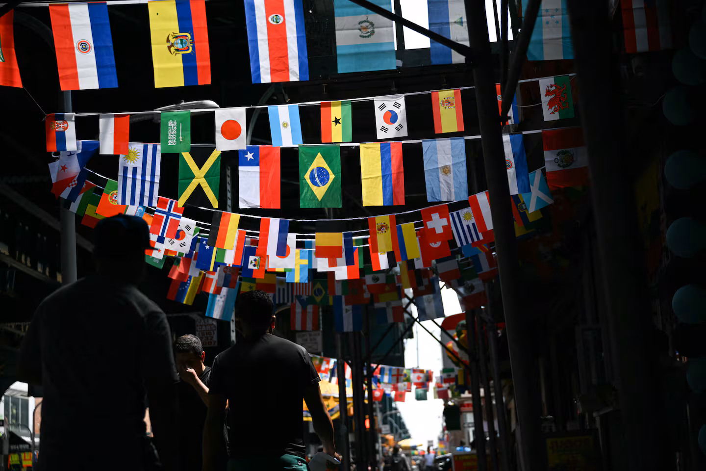 National flags hang above a street in the Queens borough of New York City on opening day of the 2026 World Cup football tournament.