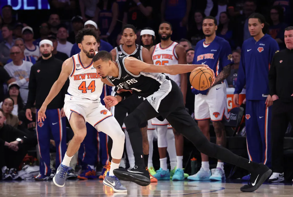 New York Knicks guard Landry Shamet #44 defends against San Antonio Spurs forward Victor Wembanyama #1 in the 4th quarter of Game 3 of the 2026 NBA Finals.