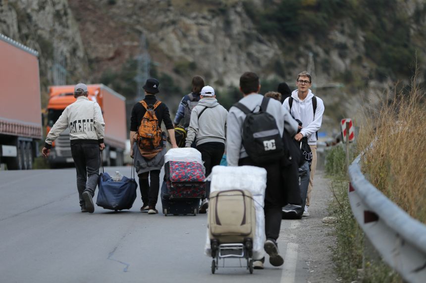 People are seen trying to leave Russia at the border with Georgia in September 2022, shortly after Putin's partial mobilization.