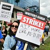 Writer Ilana Pena holds her sign on the picket line on the fourth day of the strike by the Writers Guild of America in front of Netflix in Hollywood, California, on May 5, 2023.