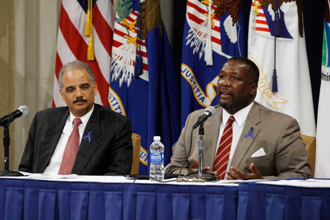 U.S. Attorney General Eric Holder, left, and Wendell Pierce participate in a panel discussion during a Federal Interagency Drug Endangered Children (DEC) Task Force event at the Justice Department May 31, 2011 in Washington, D.C. The event was organized to announce a public awareness campaign, addressing the challenges faced by children and families affected by drug abuse.