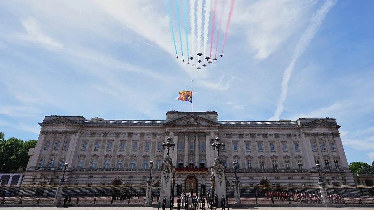 King Charles III and British family members watch Royal Air Force plane flypast over Buckingham Palace