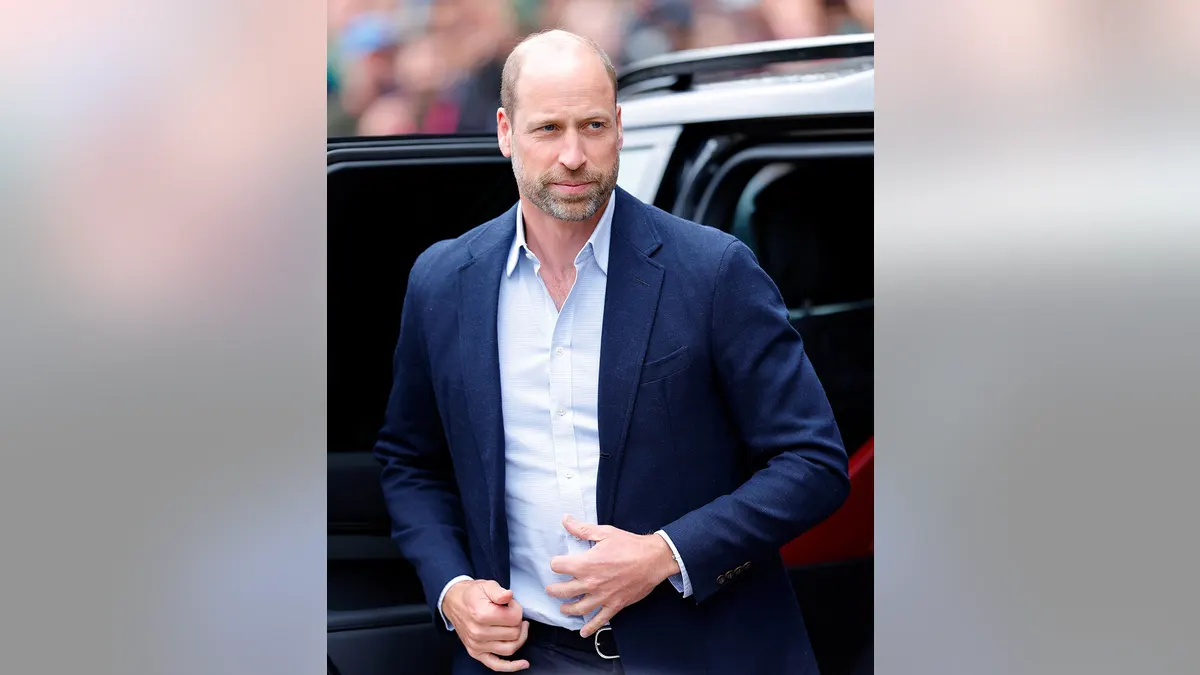 Prince William exiting a chauffeur-driven Land Rover Discovery in London.