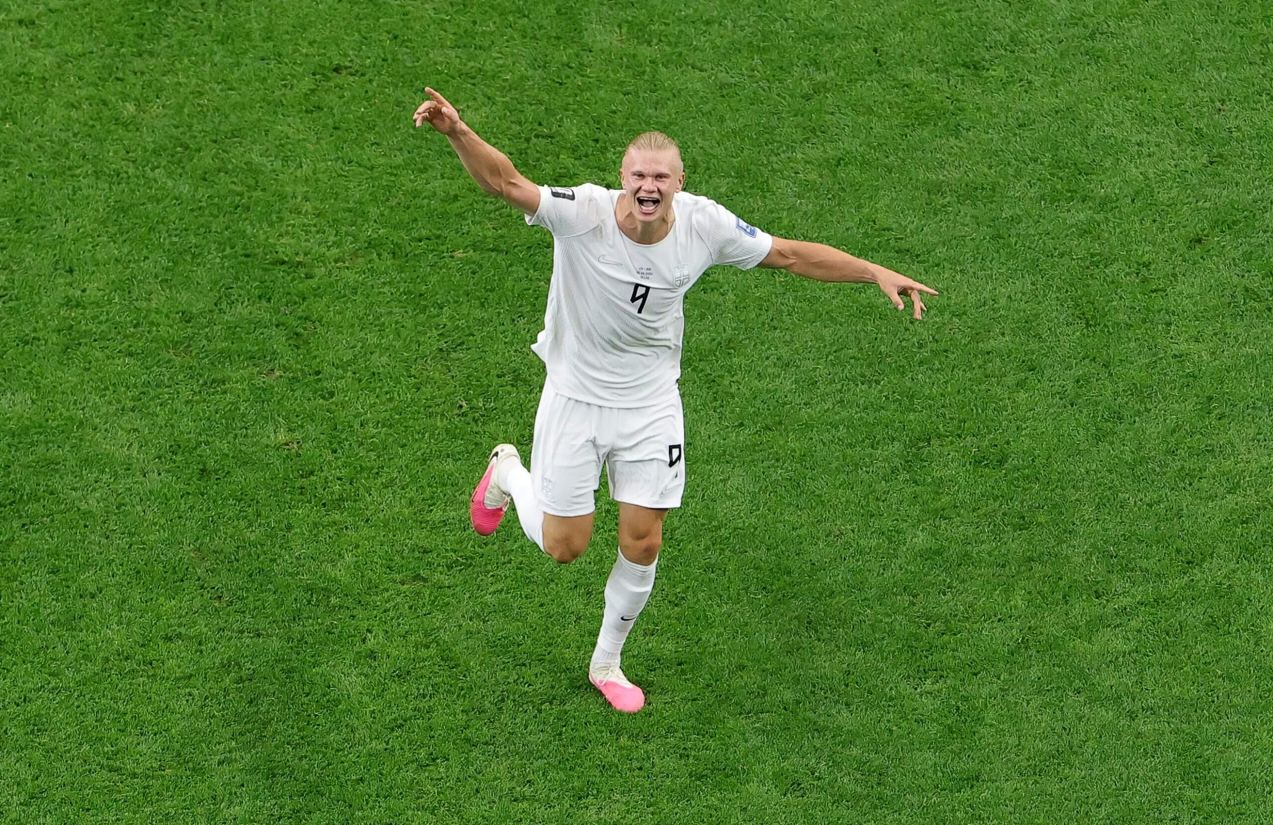 Norway's Erling Haaland runs with arms outstretched as he celebrates his team's 2-1 win over Ivory Coast