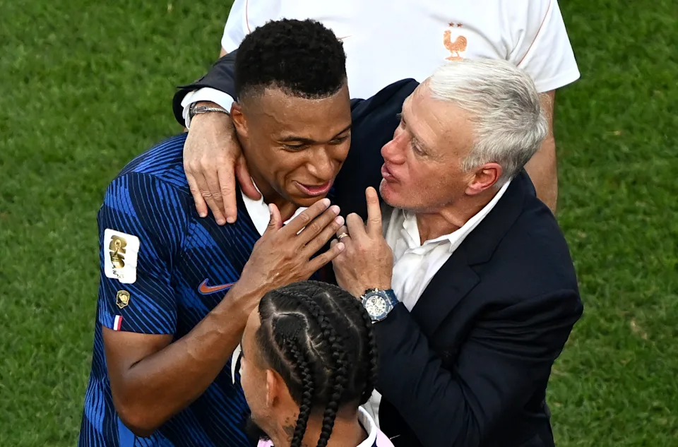 France's forward #10 Kylian Mbappe celebrates with his coach Didier Deschamps after winning the 2026 World Cup round of 16 football match between Paraguay and France at the Philadelphia Stadium in Philadelphia on July 4, 2026. (Photo by Jewel SAMAD / AFP via Getty Images)