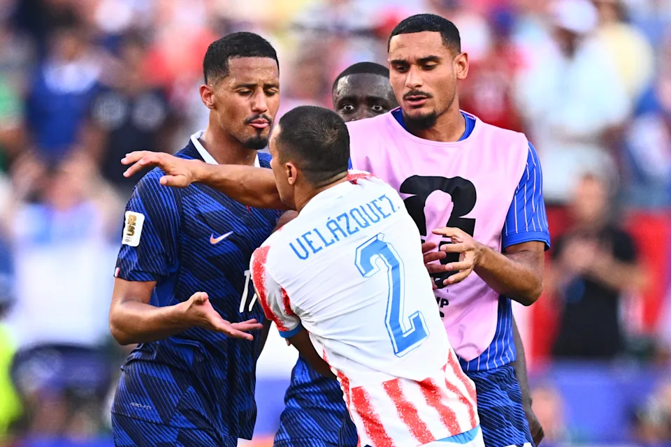 04 July 2026, United States, Philadelphia: Soccer, Men, 2026 World Cup, Paraguay vs. France, Knockout Stage, Round of 16, Philadelphia Stadium, Gustavo Velázquez (Paraguay, M) gets into a scuffle with William Saliba (France, L) and Maxence Lacroix after the game. ATTENTION: In accordance with FIFA regulations, these images may be used exclusively for editorial purposes. Commercial use is prohibited. Furthermore, no video-like sequences may be created, and no alterations may be made to the image, either in the foreground or the background. Photo: Tom Weller/dpa (Photo by Tom Weller/picture alliance via Getty Images)