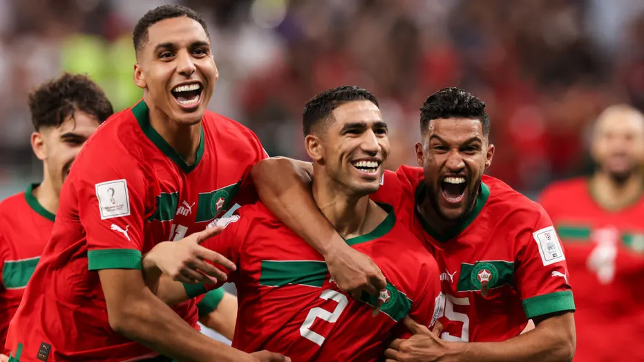 Achraf Hakimi of Morocco celebrates after scoring the winning penalty as Morocco defeats Spain on penalties during the FIFA World Cup Qatar 2022 Round of 16 match between Morocco and Spain at Education City Stadium on Dec. 6, 2022, in Al Rayyan, Qatar. (Photo by Ian MacNicol/Getty Images)