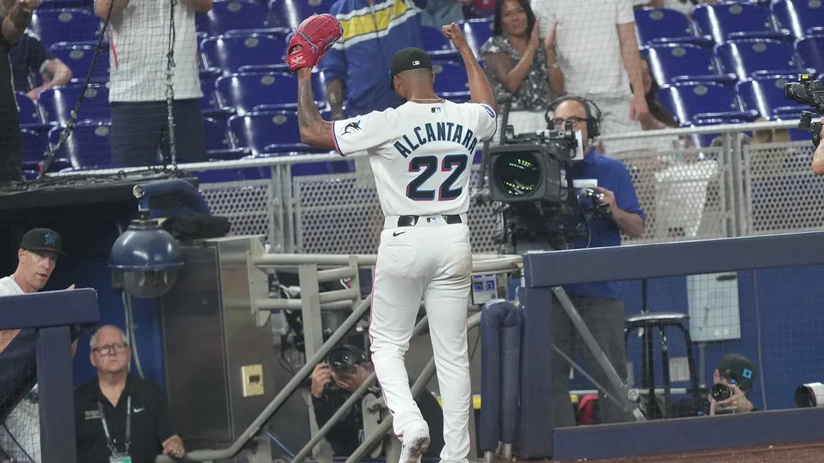 Miami Marlins starting pitcher Sandy Alcantara (22) acknowledges the fans as they celebrate his 1,002 career strikeouts during the game against the Texas Rangers at loanDepot Park.