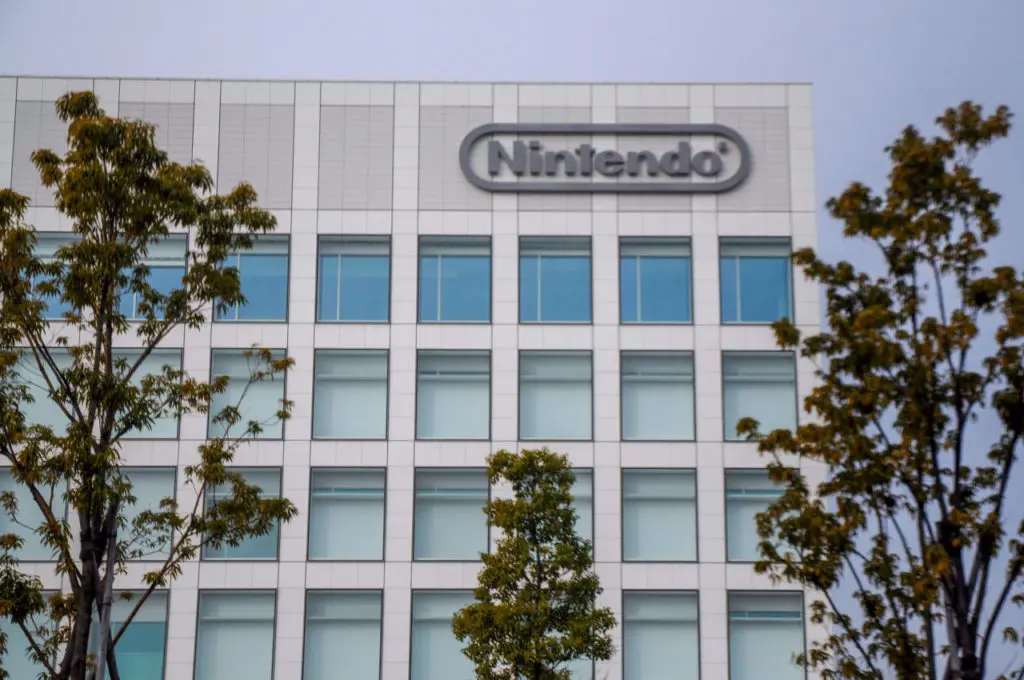 Nintendo headquarters building in Kyoto with logo visible on top.