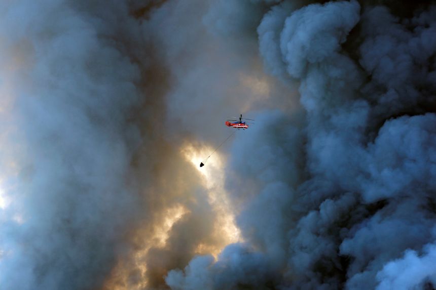 A firefighting helicopter attempts to extinguish a fire at the Russian e-commerce firm Wildberries' logistics complexes in the town of Elektrostal outside Moscow on July 18.
