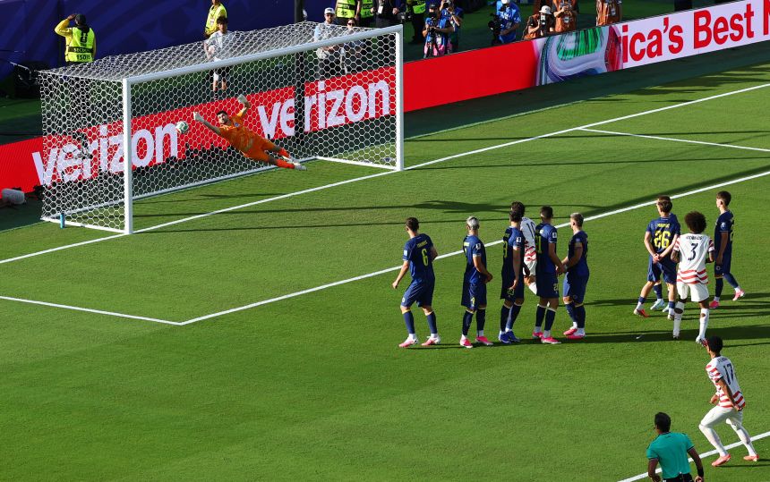 Malik Tillman's free kick curls into the net.
