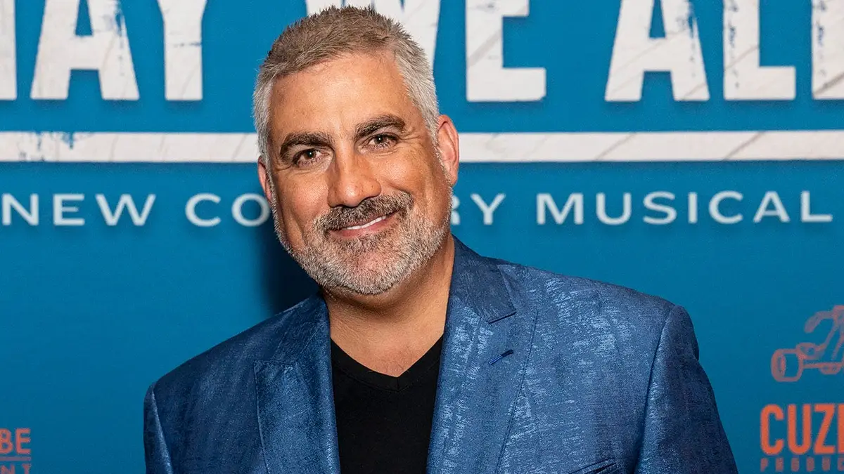 Taylor Hicks standing in front of a microphone at Tennessee Performing Arts Center in Nashville