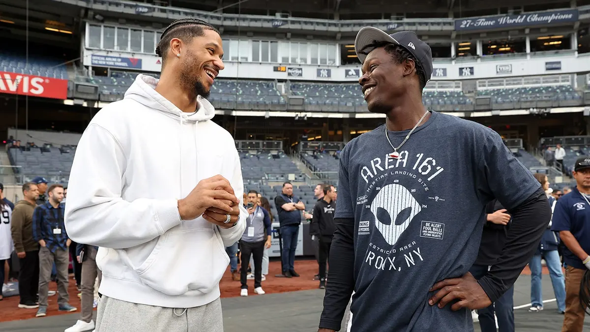 Josh Hart and Jazz Chisholm Jr. talk before a game at Yankee Stadium.