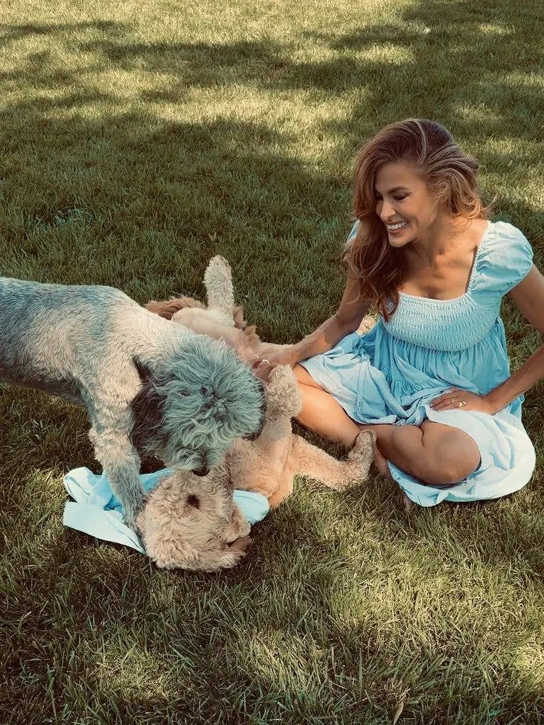 Eva Mendes posing with her two dogs, Magic and Charlie, shared via Instagram