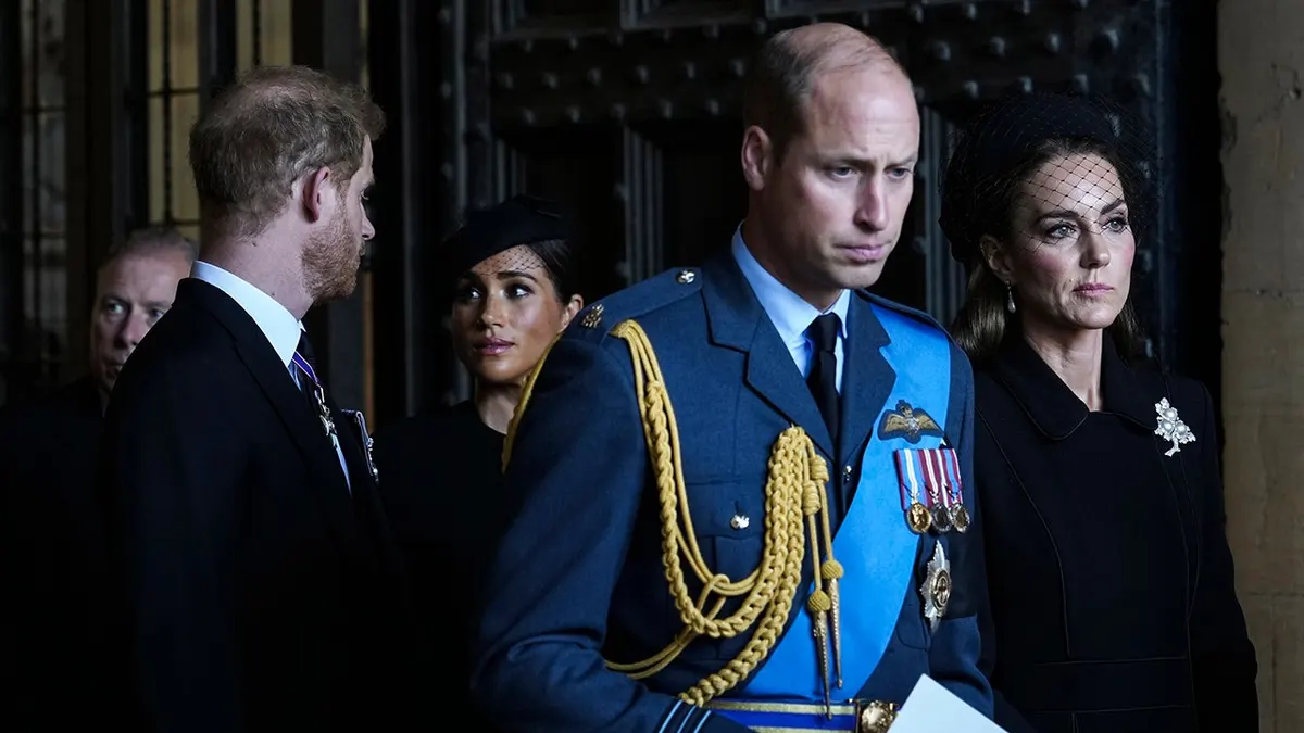 Prince William, Catherine, Prince Harry and Meghan leave after escorting Queen Elizabeth II's coffin to Westminster Hall.
