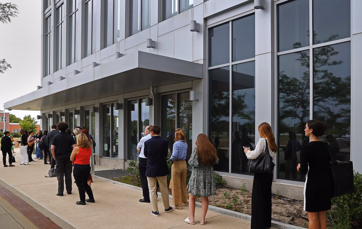 People gathered outside the Plymouth Superior Court before the trial started on July 29.