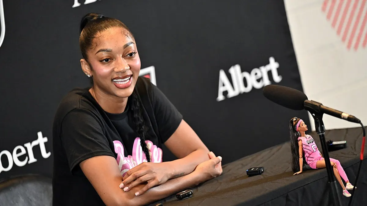 Angel Reese speaks during a press interview before the game.