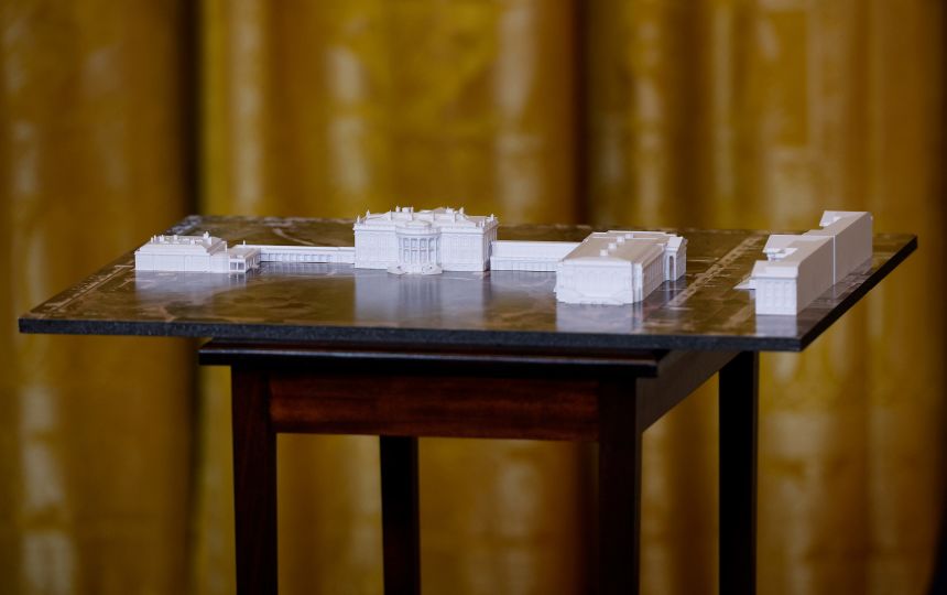 A model of the White House and proposed ballroom is displayed during a ballroom fundraising dinner with President Donald Trump in the East Room on October 15, 2025.
