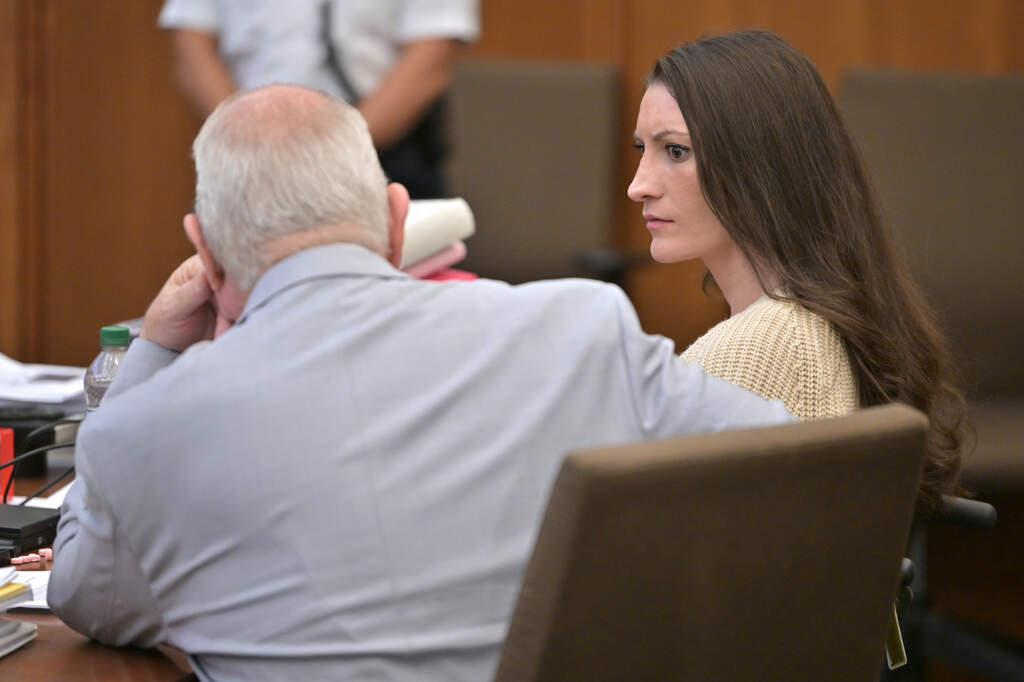 Lindsay Clancy speaks with her lawyer Kevin Reddington during proceedings in her murder trial on Thursday. (Josh Reynolds, Pool/AP)