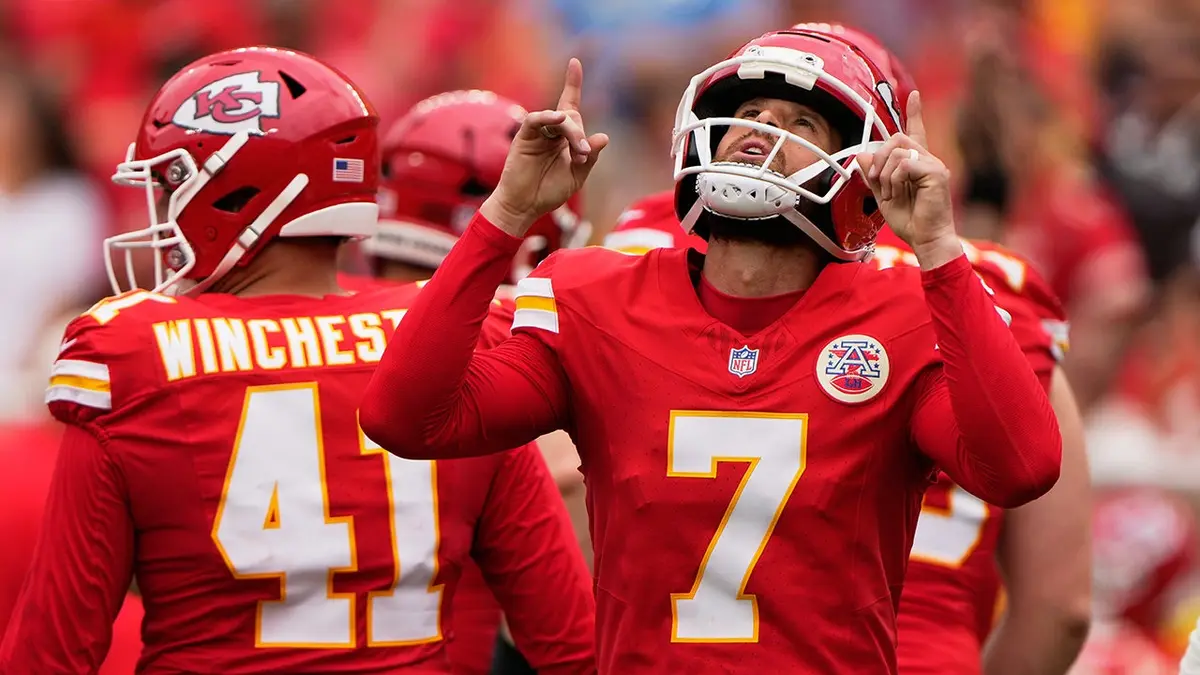 Harrison Butker celebrates after scoring during an NFL preseason game between the Kansas City Chiefs and Los Angeles Rams.