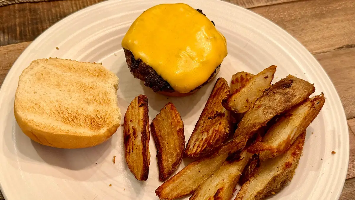 Screencaps reader Gen X Warren M checks in with cheeseburgers on the grill.