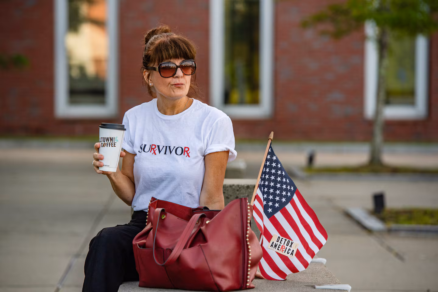 A supporter of Lindsay Clancy sits outside the courthouse before the start of jury deliberations at Plymouth Superior Court in Plymouth, Massachusetts, on August 31, 2026.