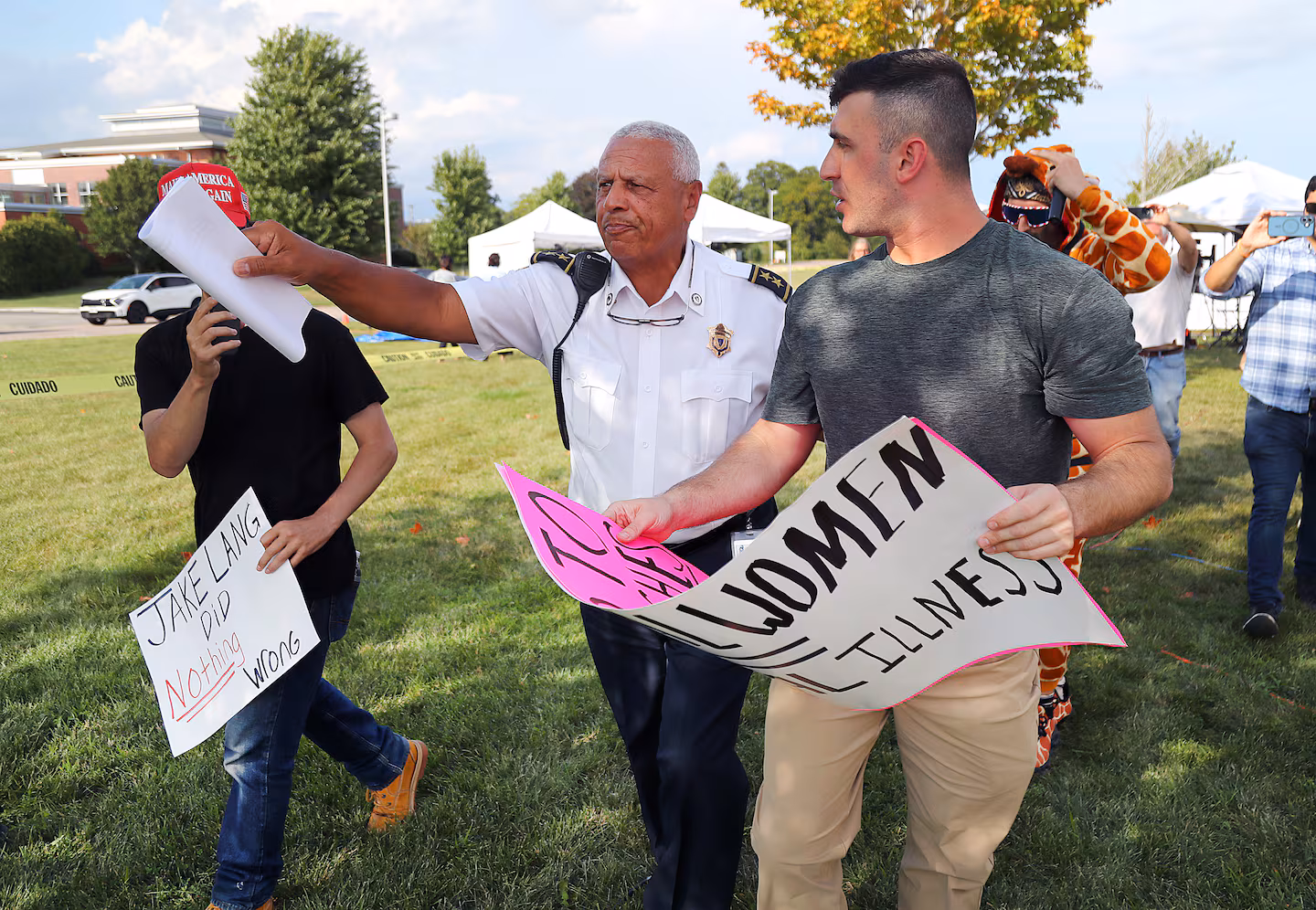 Court officers tried to escort protestors away from the courthouse in Plymouth at the end of the day on Friday, Aug. 28, after the jury was sent home.