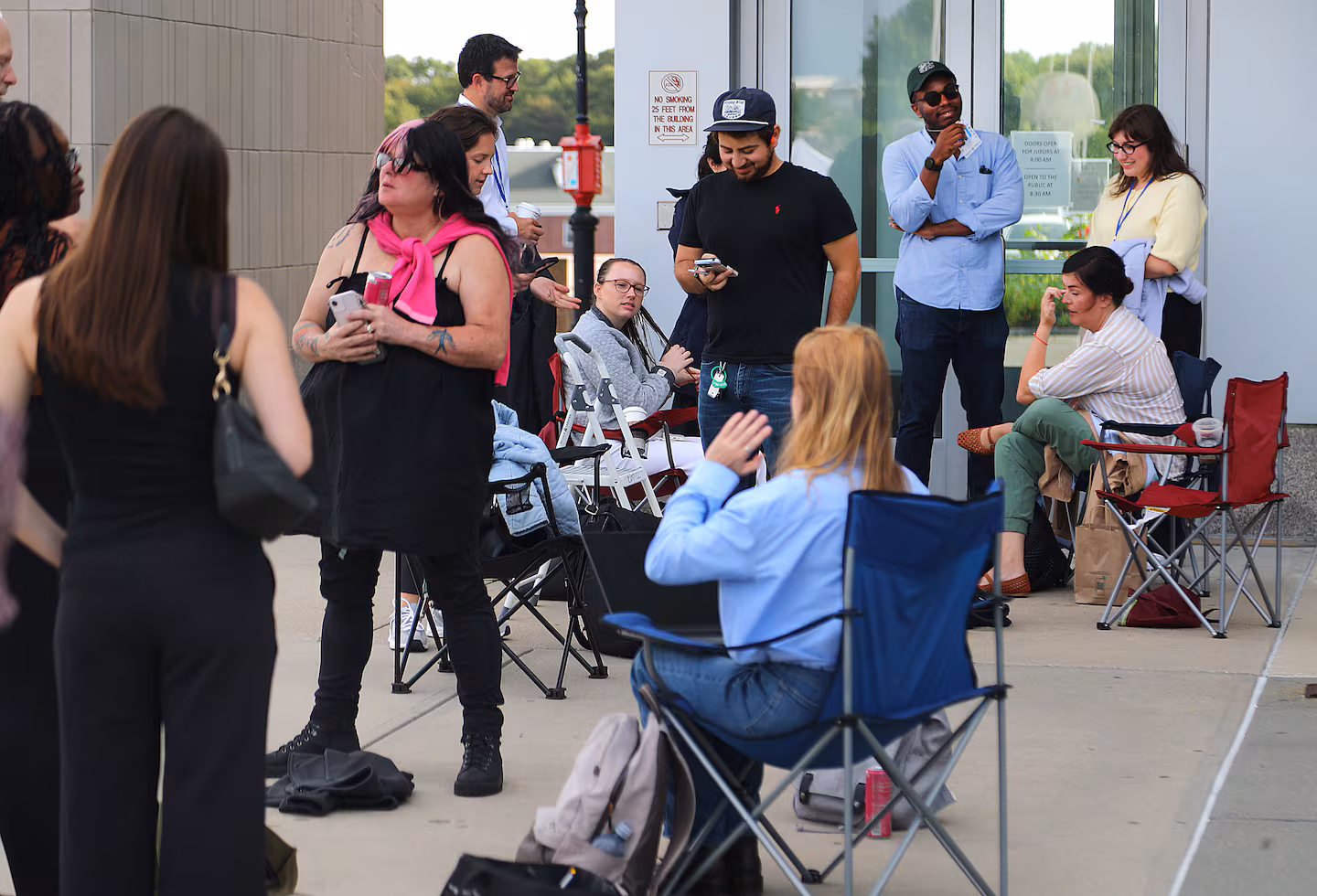 Members of the media and public lined up before court opened to get inside on Friday, Aug. 28.