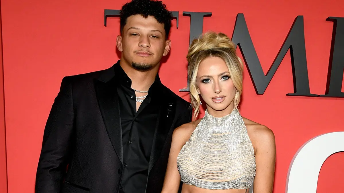 Patrick Mahomes and Brittany Mahomes posing at the 2024 TIME100 Gala in New York City