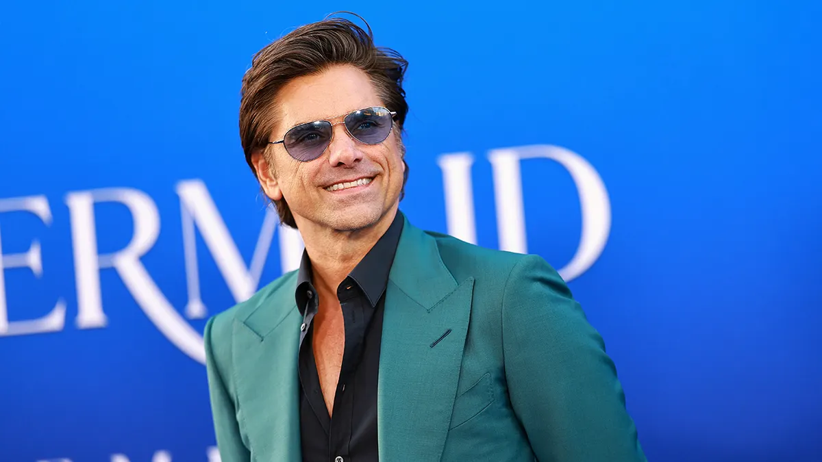 John Stamos at the premiere of the live action 