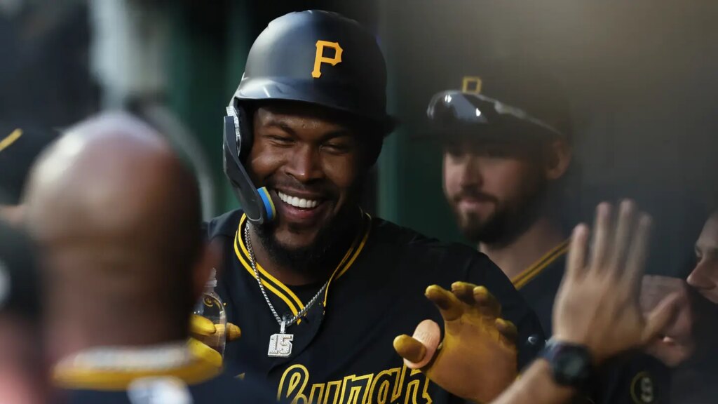 May 12, 2026; Pittsburgh, Pennsylvania, USA;  Pittsburgh Pirates center fielder Oneil Cruz (15) celebrates in the dugout after scoring a run against the Colorado Rockies during the fifth inning at PNC Park. Mandatory Credit: Charles LeClaire-Imagn Images
