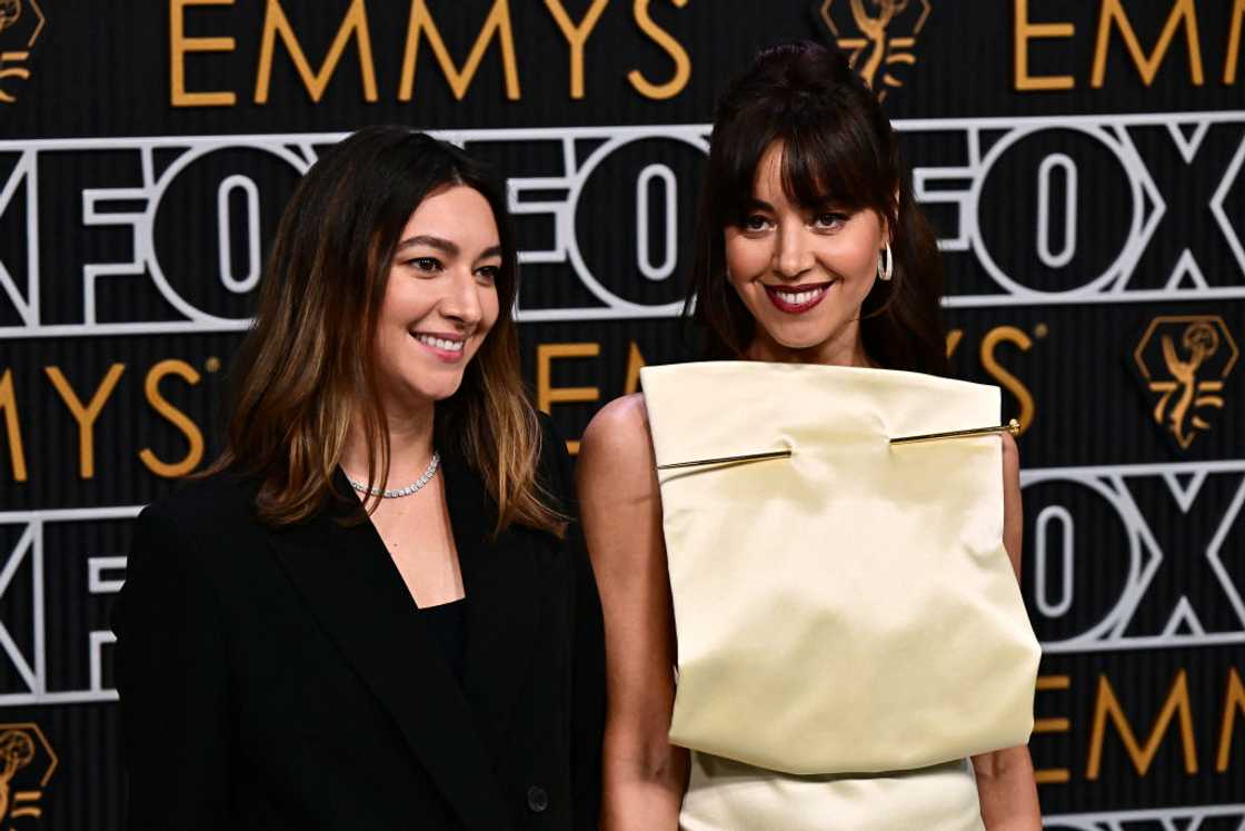 Aubrey Plaza (R) and sister Natalie Plaza (L) posing for a photo at an event Aubrey Plaza (R) and sister Natalie Plaza (L) posing for a photo at an event