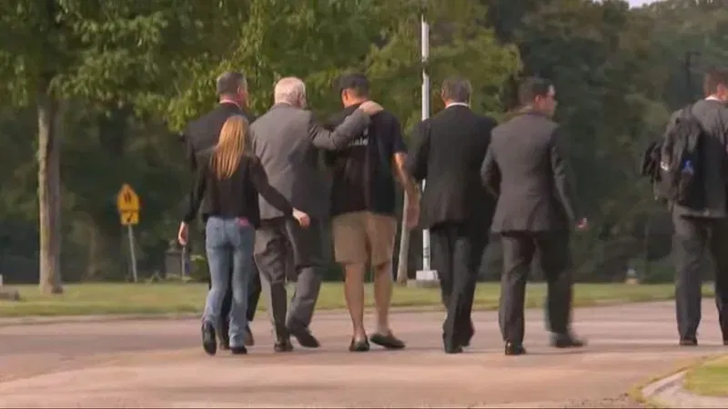 Online creator “Court Dawg Daniel”  walks with Lindsay Clancy's defense team. (WJAR)