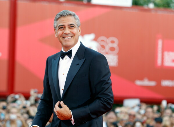 George Clooney poses on the red carpet at the premiere of his film